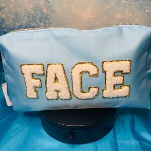 Blue Cosmetic Bag with Gold and White “FACE” Lettering NWT
